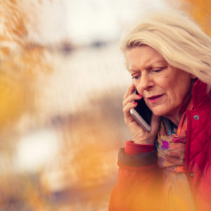 Distressed woman on cell phone